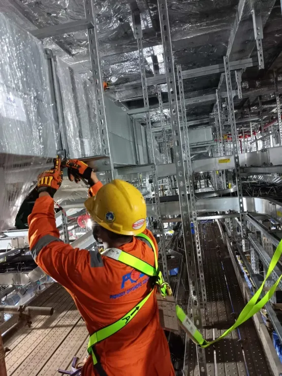 Pioneer Offshore Solutions technician at height in a harness renewing crane jib structure